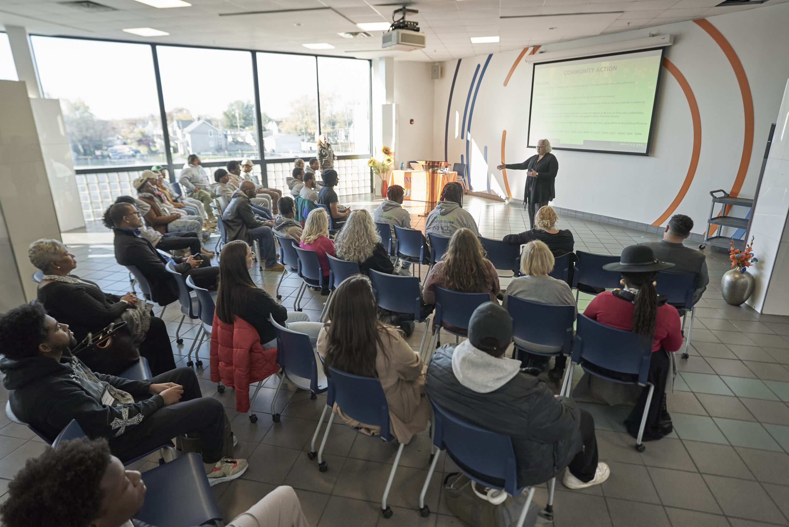 Speaker in front of attendees in a breakout session