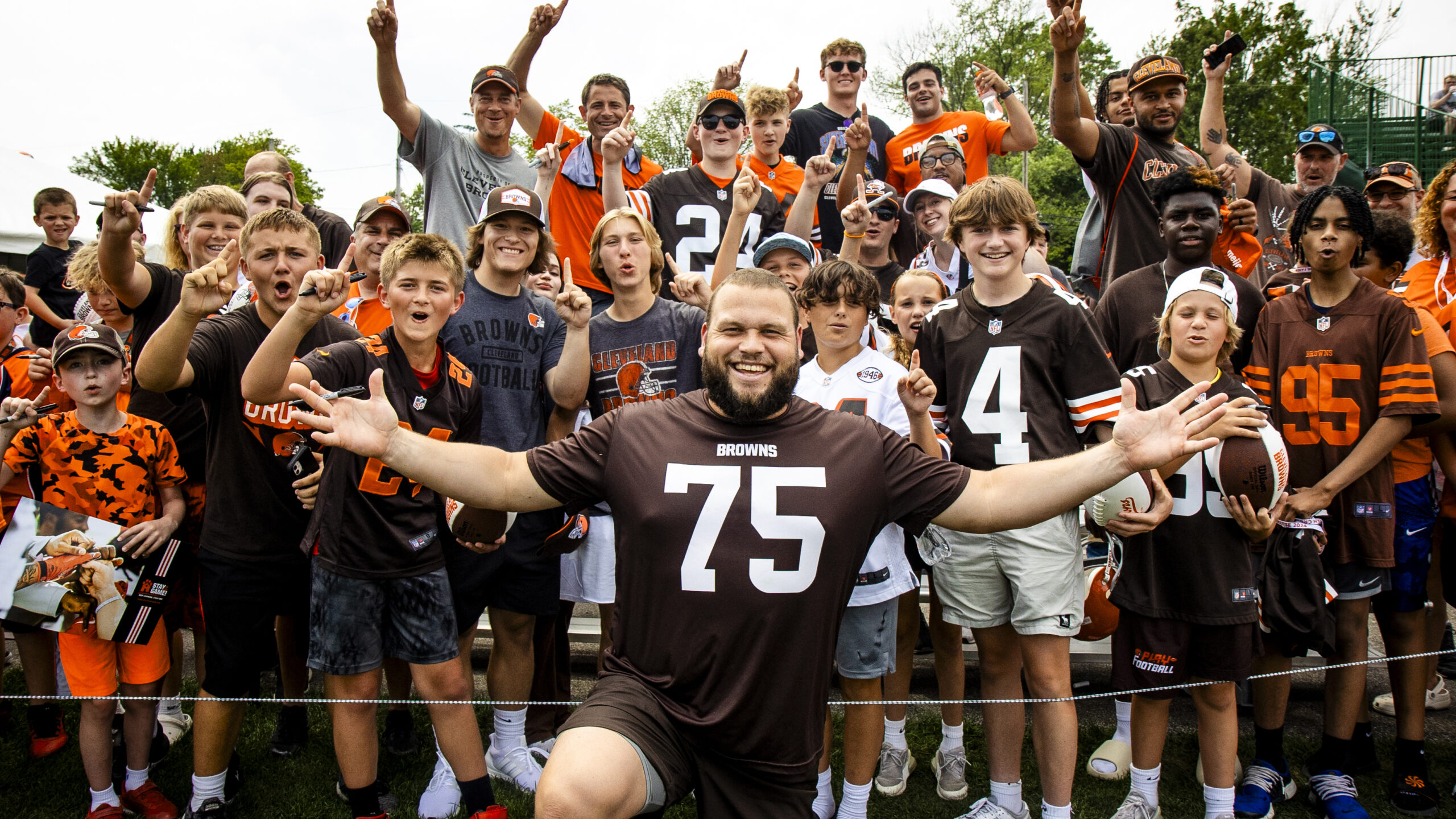 Coach and a group of kids posing