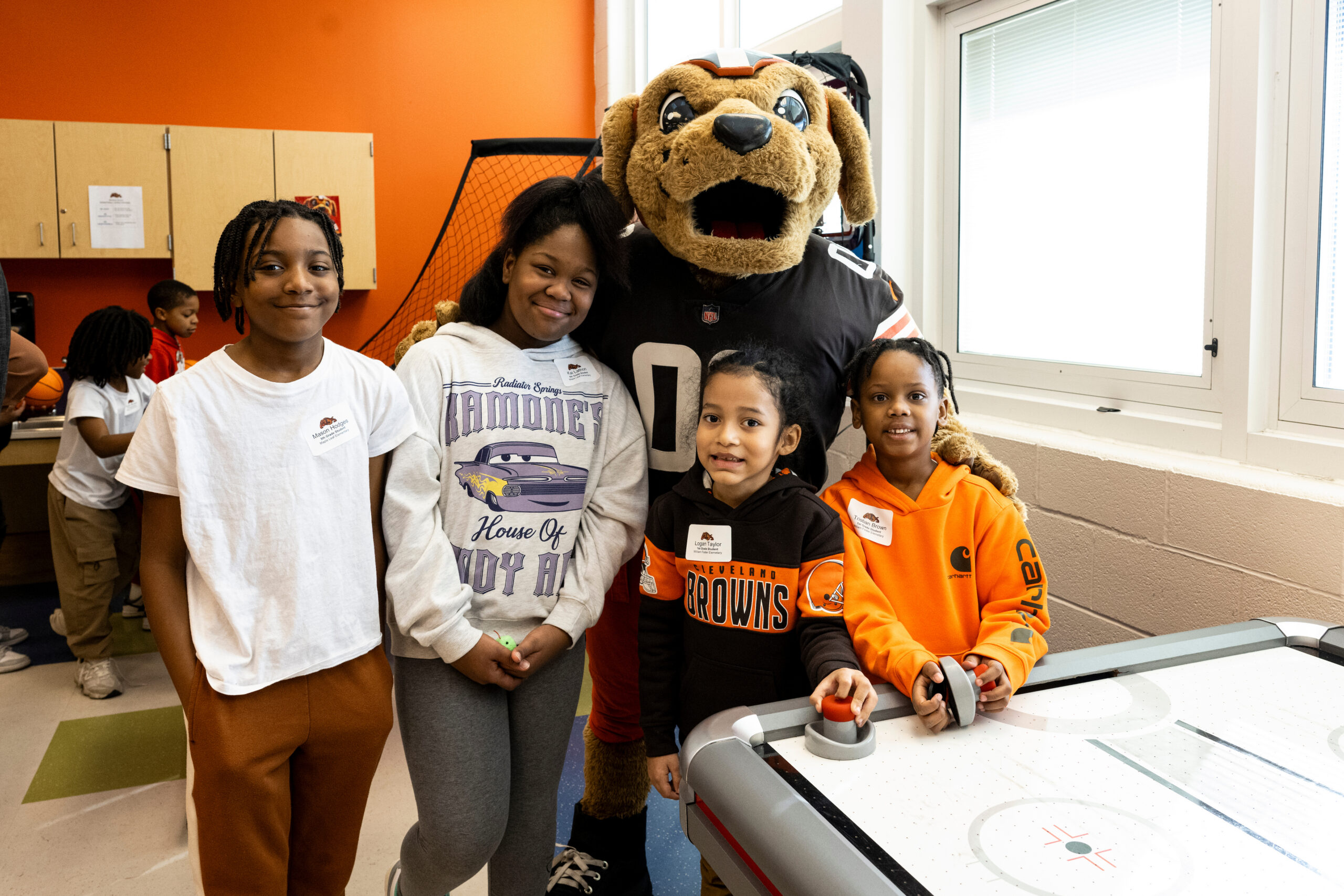 Cleveland Brown mascot with a group of kids