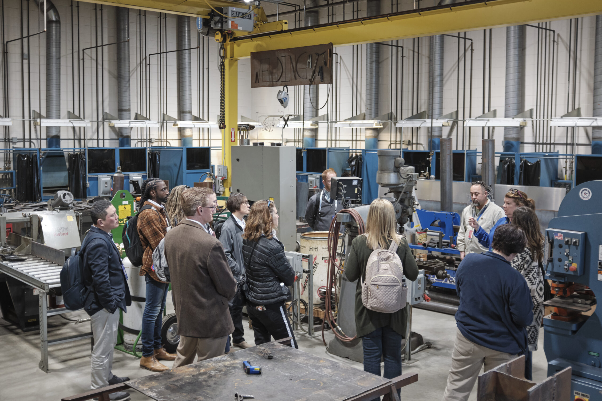 Group of people touring the Fort Hayes Machine Shop