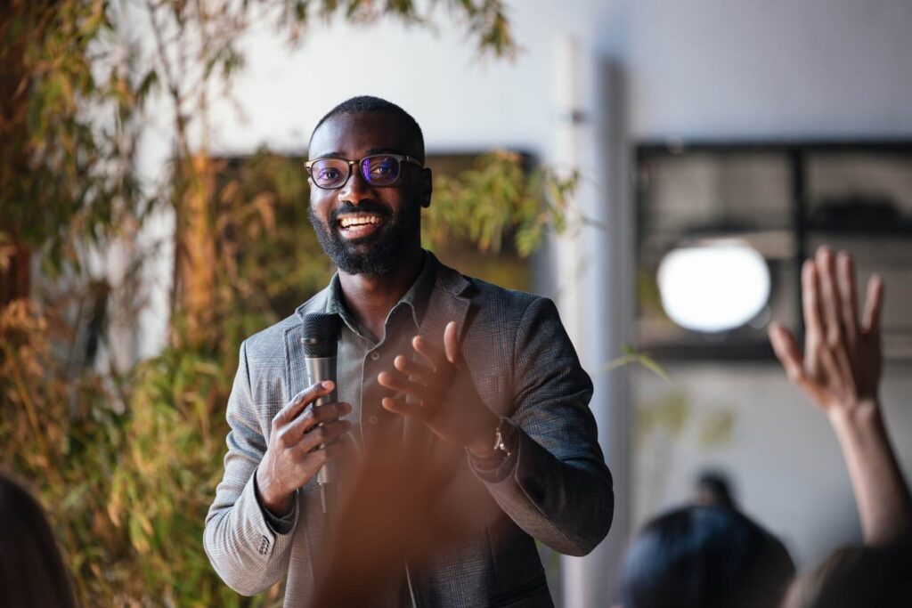 Man speaking in front of an audience