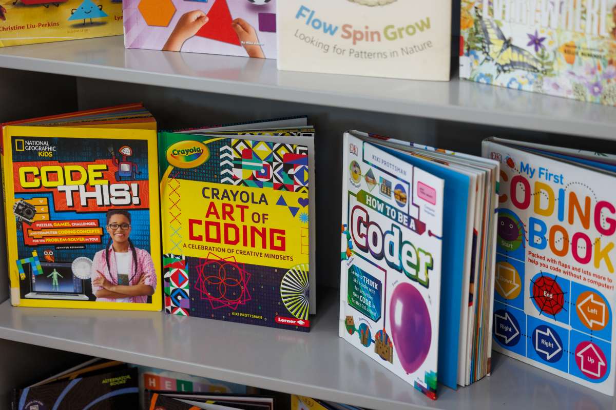 Colorful books standing on a bookshelf