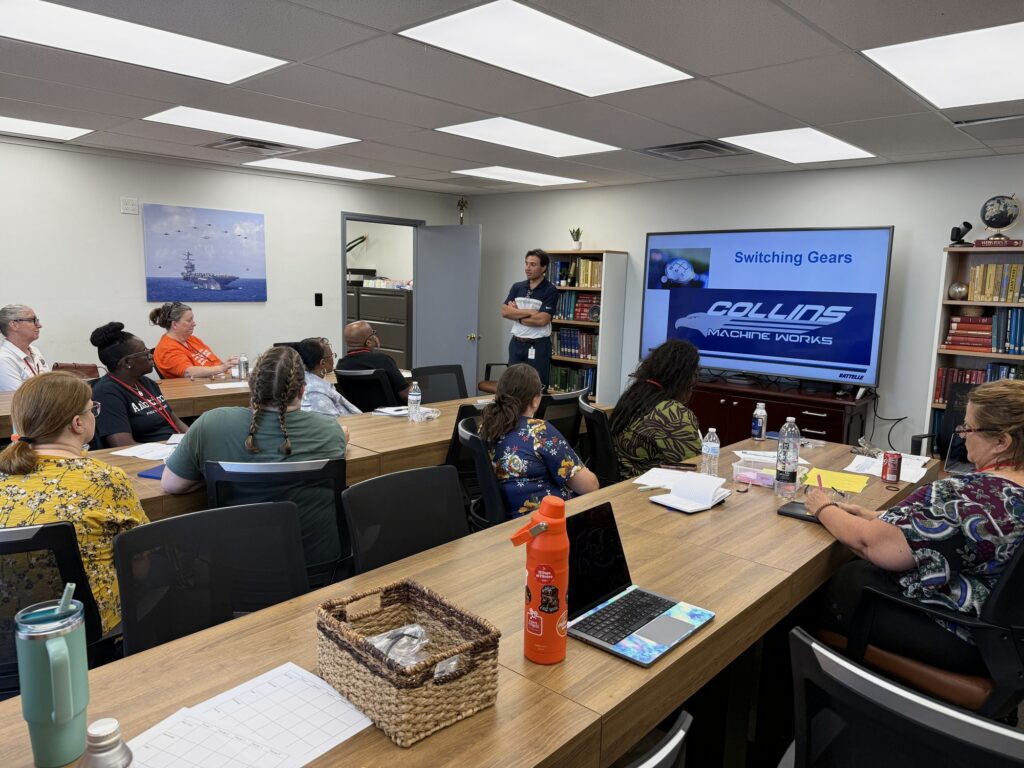 Teachers at the South Carolina kickoff session listen to a presentation from a local precision machining employer.